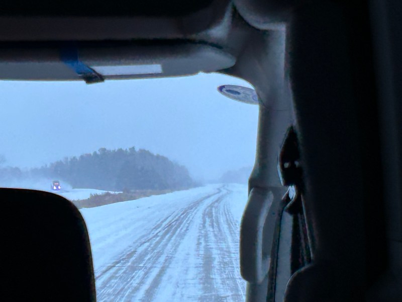 View out the front window of the Kasper minibus to a snow-covered highway